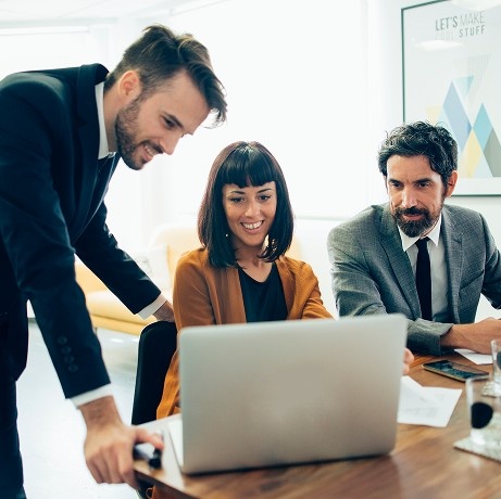 Team of business professionals collaborating, representing our innovative approach to parking solutions